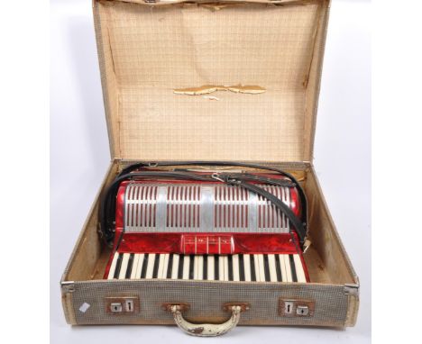 A mid 20th century vintage Italian Castelfidardo Baleani Altimoro lucite accordion in red, held within original carry case.&n