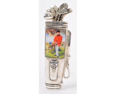 Golfing Interest.- A silver plated and enamel set vesta case and strike in the form of a golf club bag. The enamel plaque dep