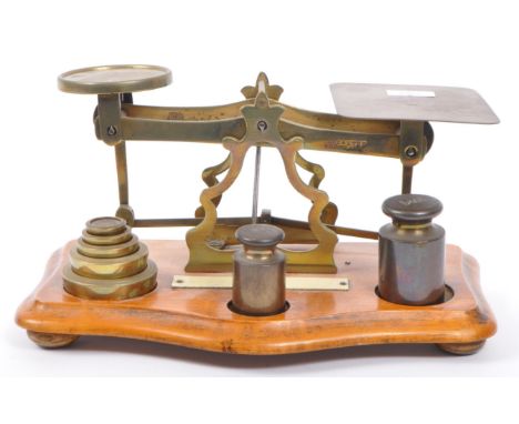 A compact vintage postal / Post Office brass weighing scales with weights made by Avery. With oak base, brass mechanism and u