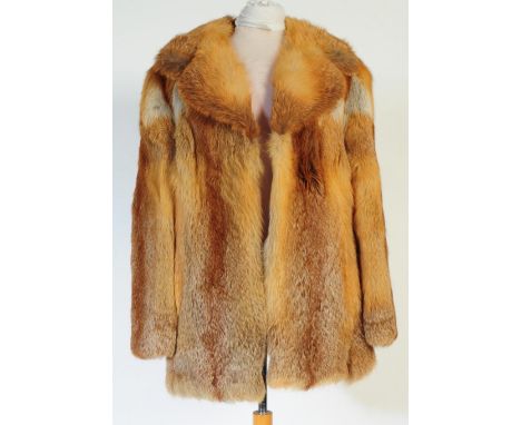 A vintage 20th century orange fox fur coat / jacket. With large folded collar and brown material lining. Measures 67cm from h