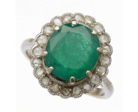 Emerald and diamond oval cluster ring the central stone approximately 2.3ct (10.8 x 9.67 x 4.51mm), surrounded by small rose 