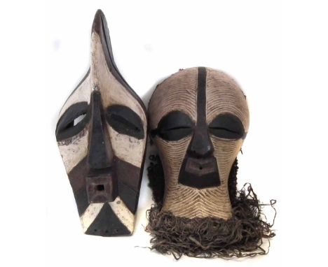 Two Songye Kifwebe masks, the largest measures 57cm high     All lots in this Tribal and African Art Sale are sold subject to