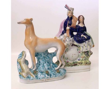 Staffordshire mantel clock ornament and a Staffordshire greyhound (2) Condition report: see terms and conditions