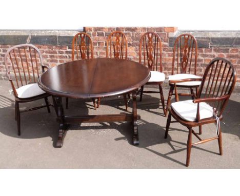 Ercol style extending dining table and six chairs (4 wheel-back and 2 others). Condition report: see terms and conditions
