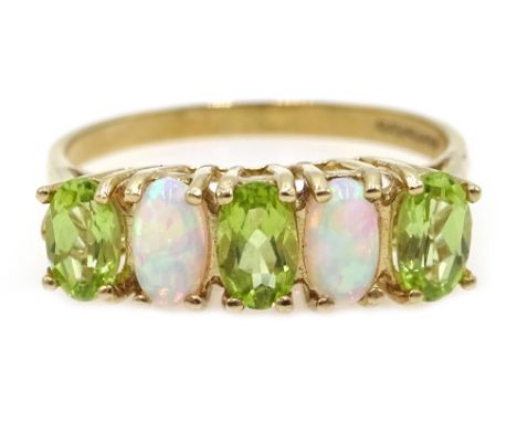 9ct gold peridot and opal ring, hallmarked Condition Report &amp; Further Details Approx 1.9gm, size M-N