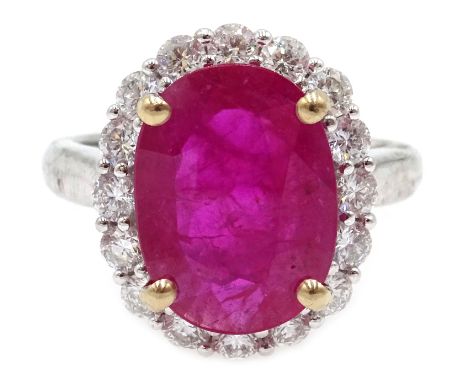 18ct white gold ruby and diamond cluster ring, stamped 750, ruby approx 3.8 carat, diamonds approx 0.8 carat  Condition Repor