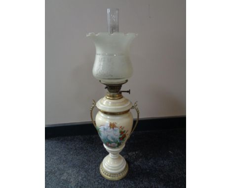 A 19th century ceramic and glass oil lamp 