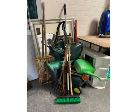 A large quantity of gardening tools, kneeler, trolley, bathroom cabinet, framed mirror, stick vac etc 