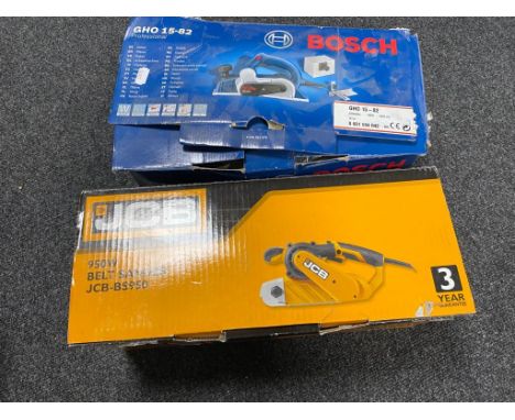 A boxed Bosch electric planer together with a JVC boxed belt sander 