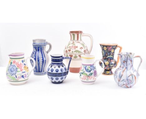 A collection of seven vintage 20th century studio pottery &amp; continental jugs. The lot to include two c1950s Poole Pottery