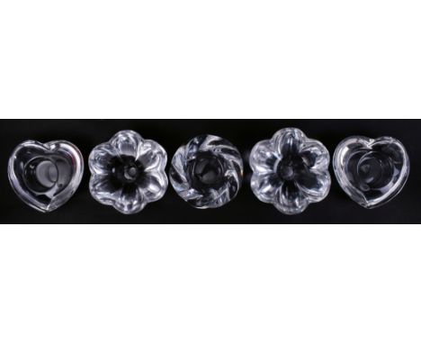 A collection of five late 20th century Scandinavian glass tea light candle holders in various shapes, four being signed Orref
