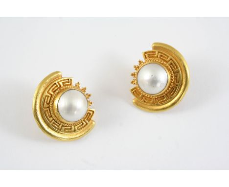 A PAIR OF GOLD AND MABE PEARL CLIP EARRINGS each 18ct gold key design mount is set with a mabe pearl, 3cm wide