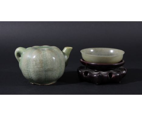 CHINESE LONGQUAN STYLE DROPPER, of melon form under a celadon glaze, length 11cm; together with a celadon jade dish, diameter