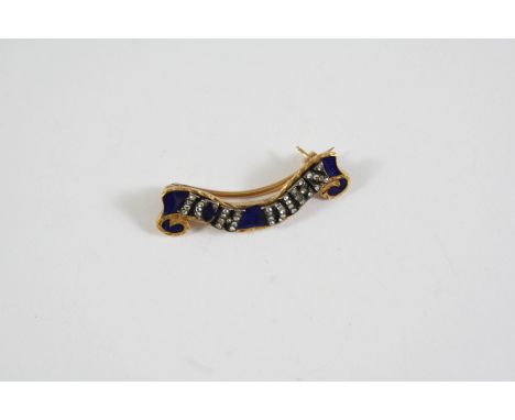 AN ENAMEL AND DIAMOND BROOCH the royal blue guilloche enamel scroll is set in gold and mounted with the diamond set motto ICH