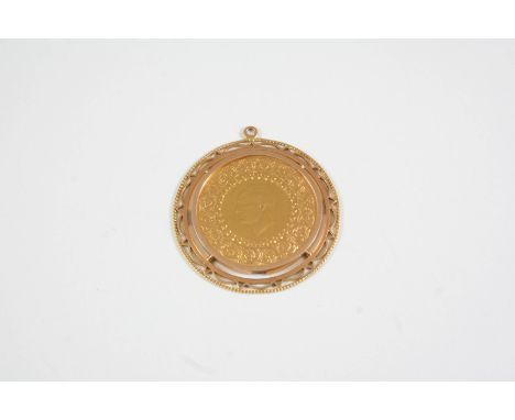 A GOLD COIN PENDANT in a gold pendant mount, total weight 11.4 grams