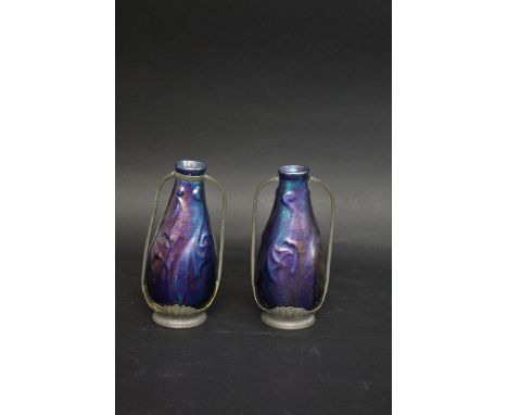 PAIR OF IRIDESCENT VASES possibly by Zsolnay, with a purple iridescent glaze and pewter mounts. Unmarked, 16.5cms high. (2)