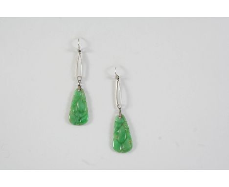 A PAIR OF JADE DROP EARRINGS with pierced and carved decoration, 5cm long