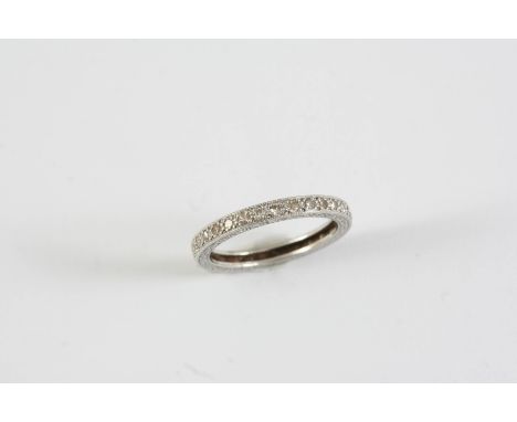 A DIAMOND FULL CIRCLE ETERNITY RING millegrain set with single-cut diamonds in engraved mount. Size K 1/2