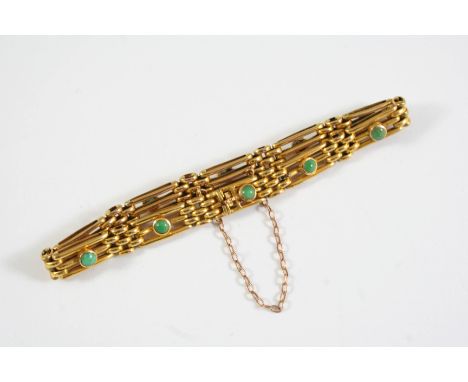 A 9CT GOLD AND TURQUOISE GATE LINK BRACELET mounted with ten circular turquoise cabochons, with concealed clasp, 18cm long, 1