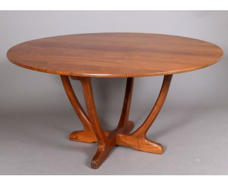 OLIVER MOREL (1916-2003) - COTSWOLD SCHOOL DINING TABLE, 1970 a large oval mahogany dining table, supported on 4 curved legs 