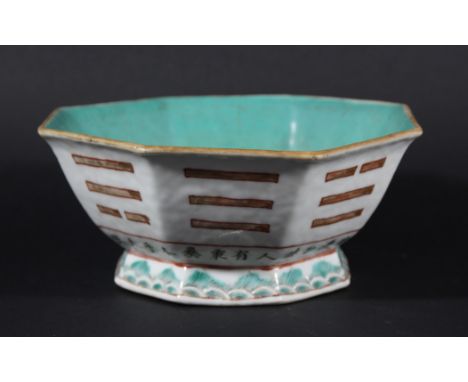 CHINESE FOOTED BOWL, 19th century, of octagonal form with trigram decoration to the exterior above a continuous inscription o