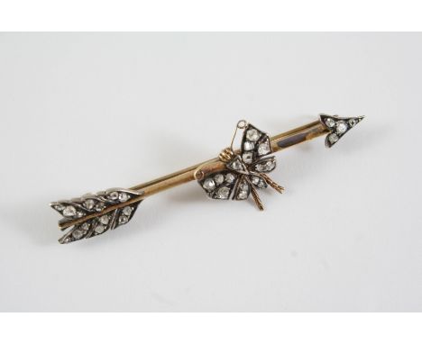 A VICTORIAN ARROW AND BUTTERFLY BROOCH mounted with rose-cut diamonds, in silver and gold, 6.2cm long