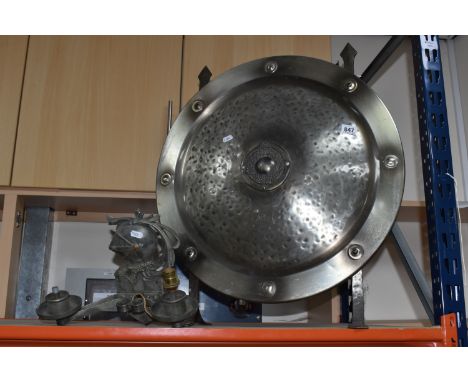 A BANKSWAY LIGHT FITTING AND SHIELD STYLE FIREGUARD comprising a metal wall mounted light fitting in the form of a knights he