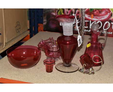 A GROUP OF CRANBERRY GLASS, six pieces comprising a jug with applied white bands around neck, height 23cm (handle rough at jo