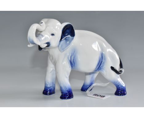 A ROYAL DOULTON BLUE FLAMBÉ ELEPHANT, HN891, with raised trunk, printed navy Royal Doulton Flambé backstamp on stomach, heigh