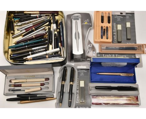 A TIN OF ASSORTED PENS AND PENCILS, to include a white metal 'Eversharp' engine turned pattern propelling pencil, stamped 'St