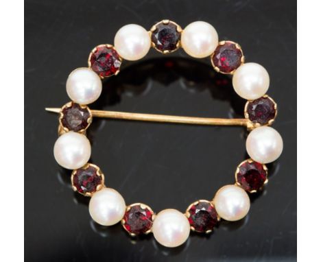 A 14k gold, pearl and garnet brooch, circular openwork frame set with alternating stones, 3cm diam