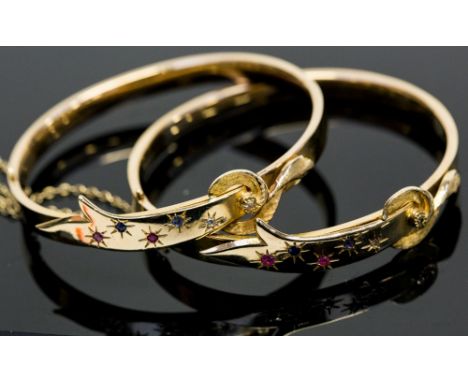 A pair of gold hinged bangles, set with ruby, sapphire and diamond, stamped 14k, 23.8g