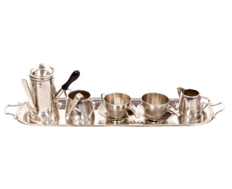 An Edwardian silver miniature coffee or chocolate service, including long tray, two cups, saucers and spoons, milk jug, sugar