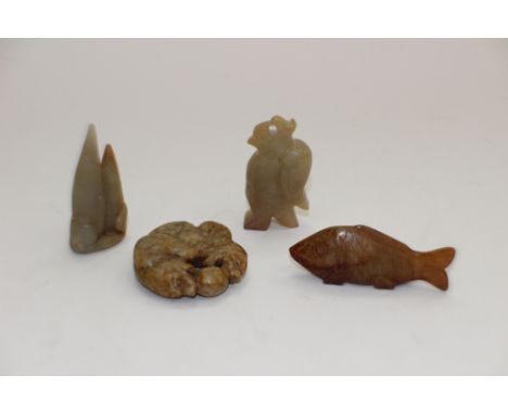 A collection of jade carvings including eagle pendant, fish, cats with ball and another, 7cm long (4)