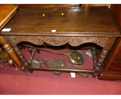 A joined and relief carved oak bobbin turned hall table, width 95cm