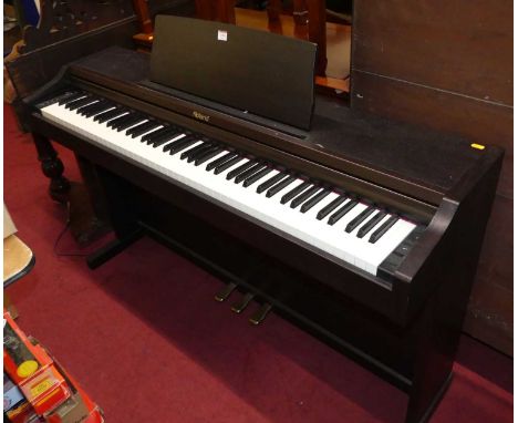 A Roland electric upright pianoThis works and sounds very good.All keys and buttons working.Some light marks to case but noth