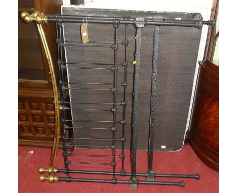 A Victorian style black painted wrought iron and brass three-quarter size bedstead, having iron side rails and twin base sect