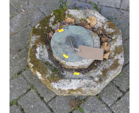 A reconstituted stone and brass mounted sundial