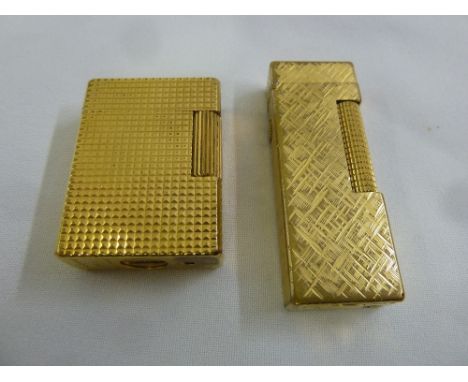 ST Dupont gilt metal cigarette lighter and a Dunhill gilt metal cigarette lighter