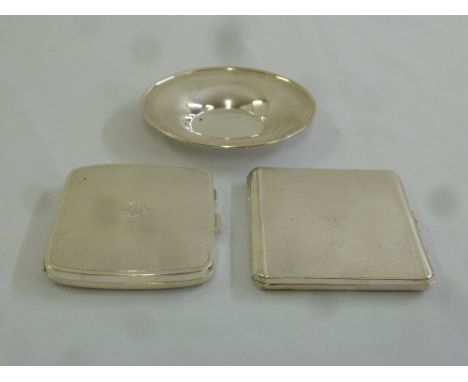 Two engine turned silver cigarette cases and a white metal pin tray