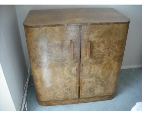 An Art Deco rectangular walnut sideboard with fitted cutlery drawers containing Kings pattern silver plated flatware for twel