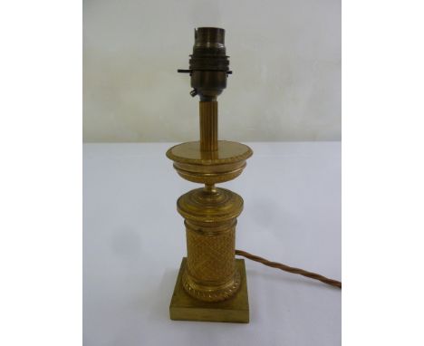 A French Ormolu table lamp of cylindrical form on raised square base