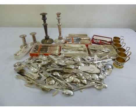 A quantity of silver plate to include candlesticks, flatware and a set of six tea glass holders