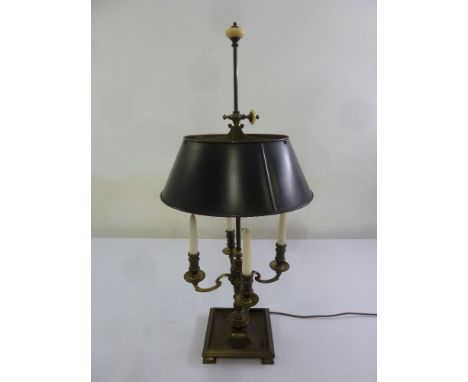 A four branch bronzed desk lamp on square base