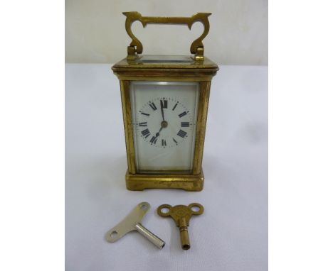 Brass carriage clock of customary form, to include keys