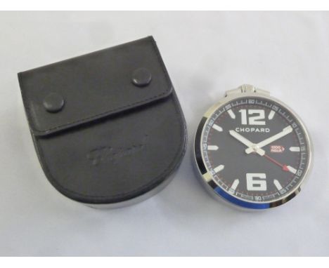 A Chopard desk clock with alarm, in fitted leather case