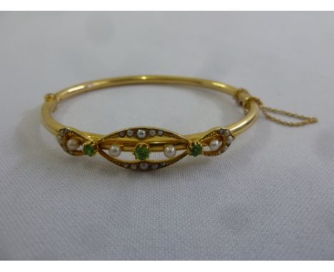 15ct yellow gold seed pearl and emerald bangle, approx total weight 9.8g