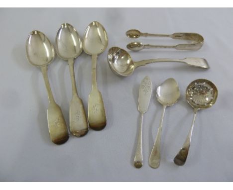 A quantity of silver flatware to include table spoons, a sauce ladle and a sifter spoon