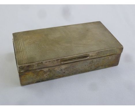 A silver rectangular engine turned cigarette box with cedarwood lining, Birmingham 1934
