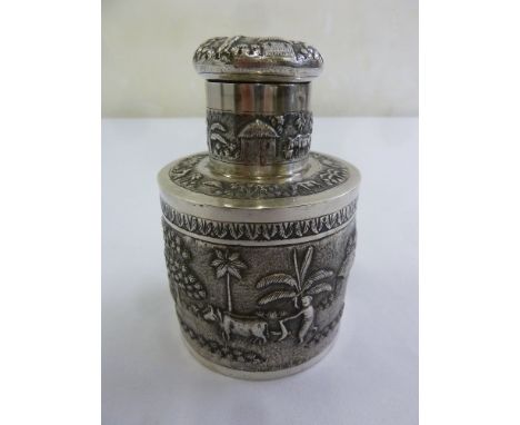 Indian silver tea caddy with embossed image of farming scene and screw-off cover
